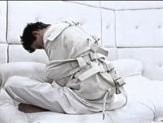 Image result for guy in straight jacket in a padded room pics