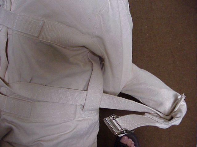 Getting into a Straitjacket.